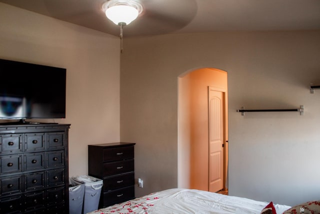 bedroom with arched walkways