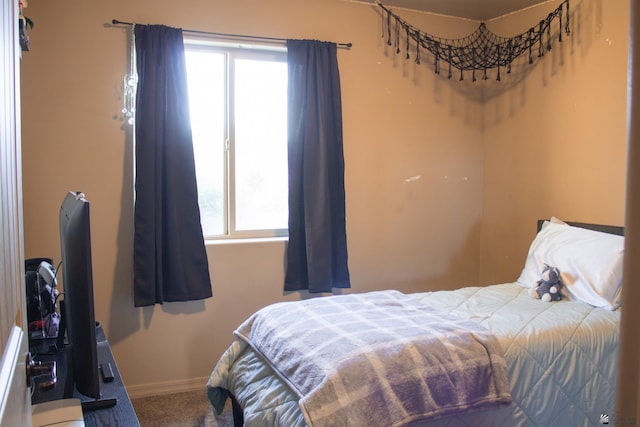 carpeted bedroom with baseboards