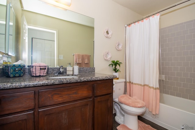 bathroom with toilet, shower / bath combo with shower curtain, and vanity