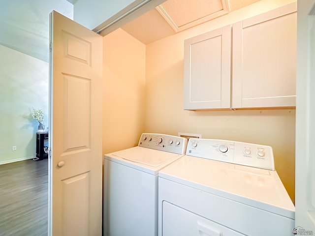 washroom with independent washer and dryer and cabinet space