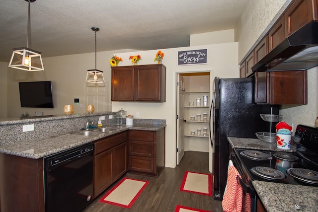 kitchen with dark wood-style floors, a peninsula, under cabinet range hood, black appliances, and a sink