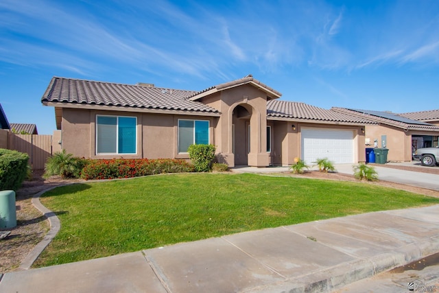 view of front of home with stucco siding, an attached garage, fence, driveway, and a front lawn