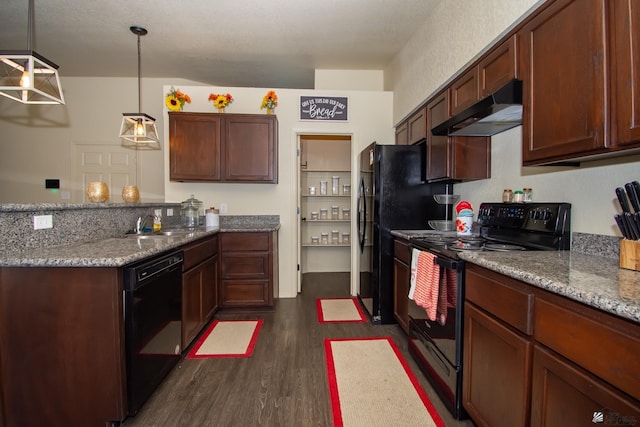 kitchen with light stone counters, dark wood-style flooring, a peninsula, under cabinet range hood, and black appliances