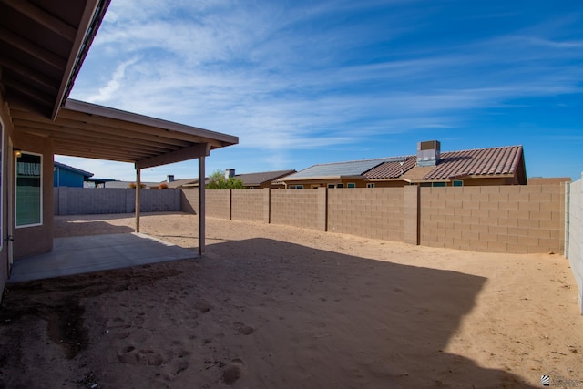 view of yard featuring a patio area and a fenced backyard