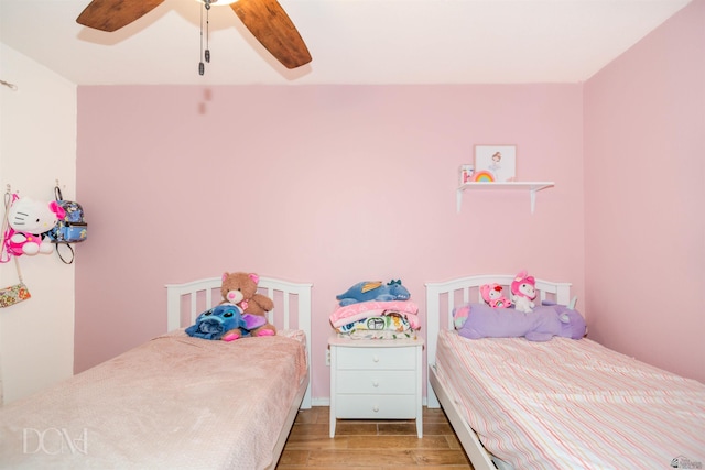 bedroom featuring ceiling fan and wood finished floors