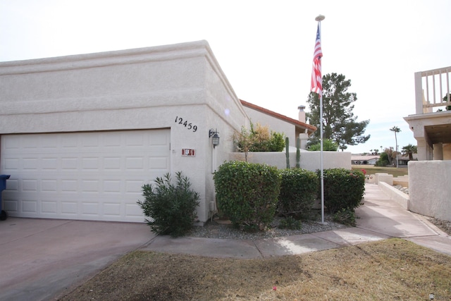 view of side of home featuring a garage