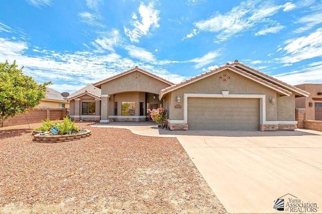 view of front of property with a garage