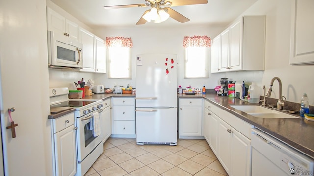 kitchen with white cabinetry, sink, ceiling fan, white appliances, and light tile patterned floors