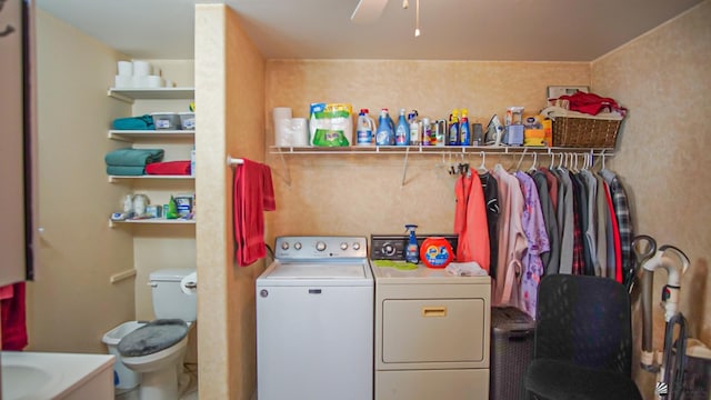 laundry room with ceiling fan, sink, and independent washer and dryer