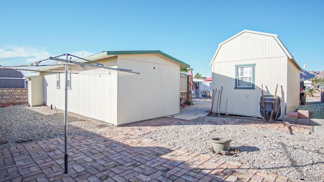 back of house with a patio