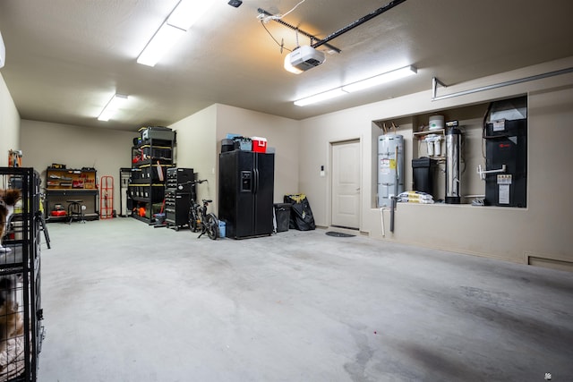 garage featuring a garage door opener, black fridge with ice dispenser, and electric water heater