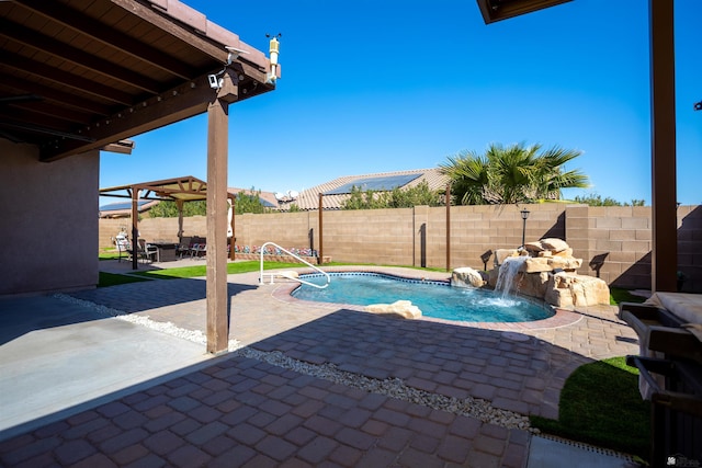 view of swimming pool with a fenced in pool, a patio, a fenced backyard, and a pergola