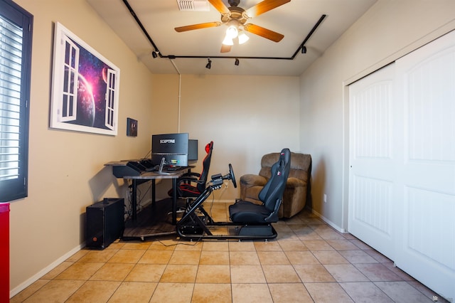 office space featuring baseboards, ceiling fan, track lighting, and tile patterned flooring