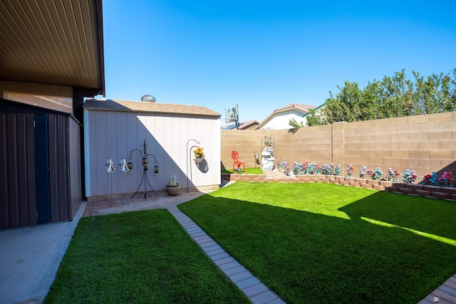 view of yard featuring an outdoor structure, a fenced backyard, and a storage shed