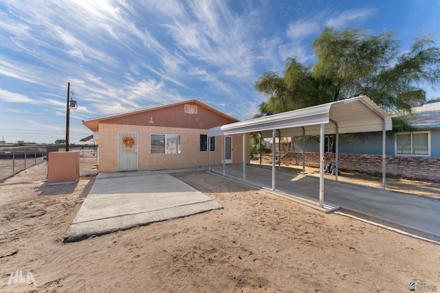 rear view of house featuring a carport