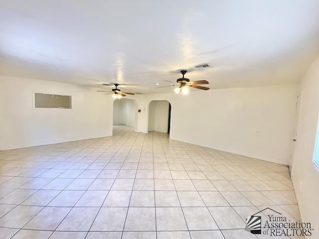 unfurnished room with ceiling fan and light tile patterned floors