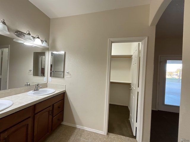 bathroom with tile patterned flooring and vanity