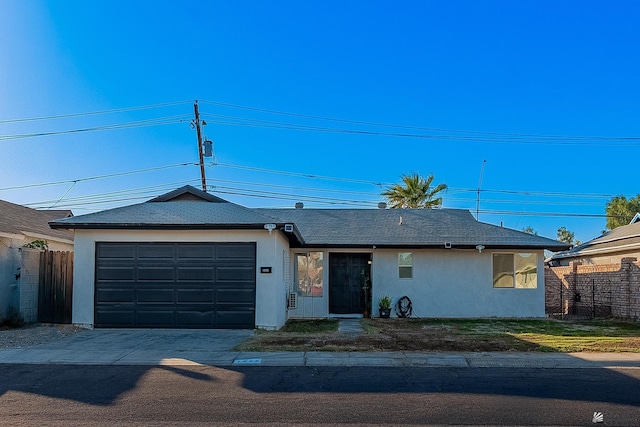 ranch-style house featuring a garage