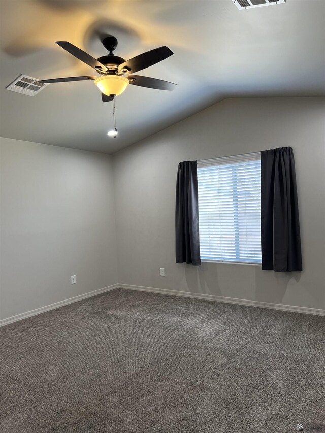 carpeted empty room with ceiling fan and lofted ceiling