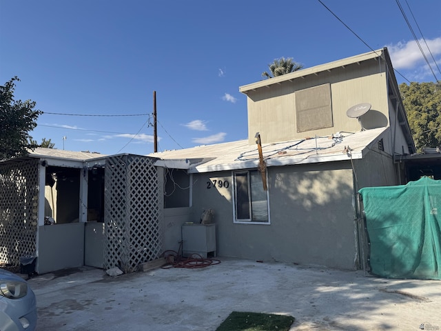 back of house featuring a patio