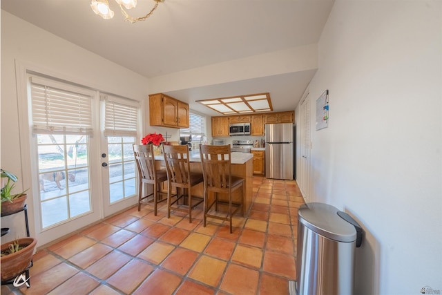 tiled dining room with french doors and plenty of natural light