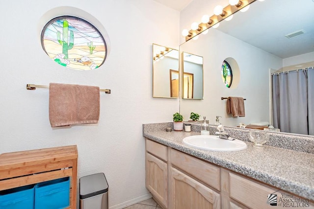 bathroom with vanity and walk in shower