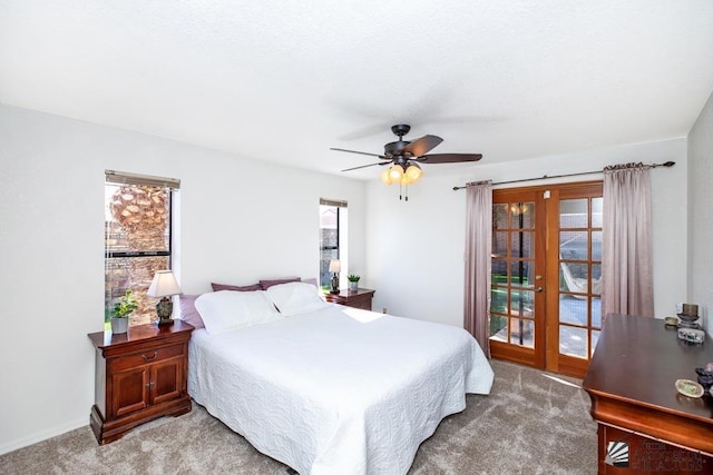 carpeted bedroom featuring french doors and ceiling fan