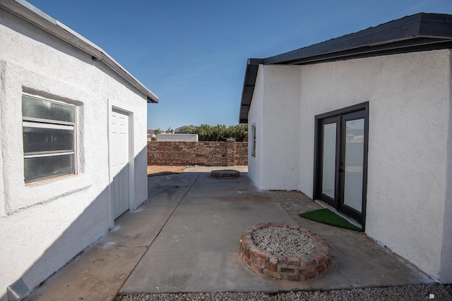 view of home's exterior featuring a patio and french doors