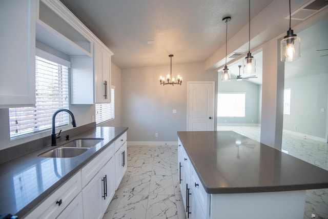 kitchen with sink and white cabinetry