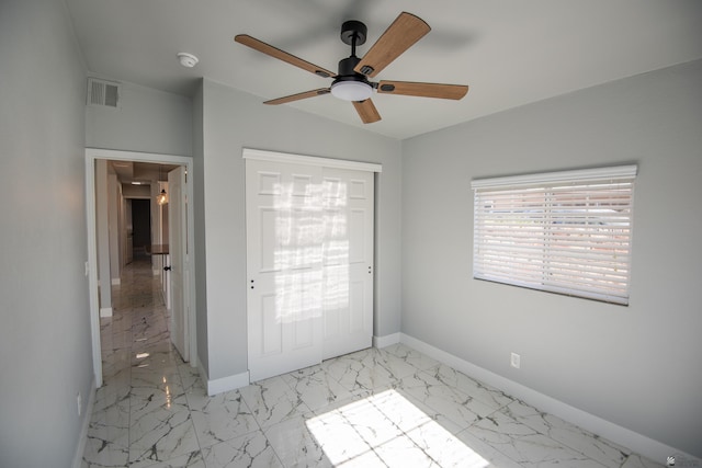 interior space with ceiling fan and lofted ceiling