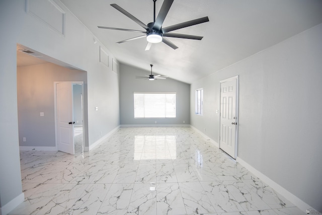 spare room with vaulted ceiling