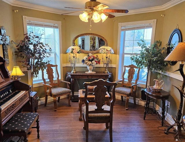 sitting room featuring crown molding, wood-type flooring, and plenty of natural light