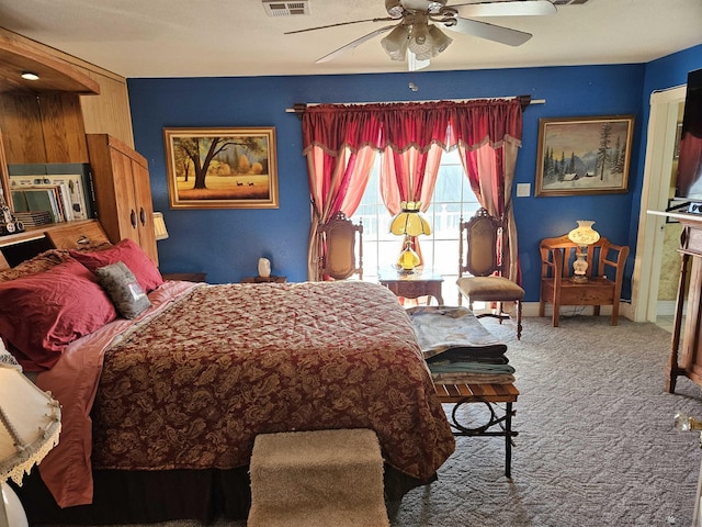 bedroom with ceiling fan and carpet floors