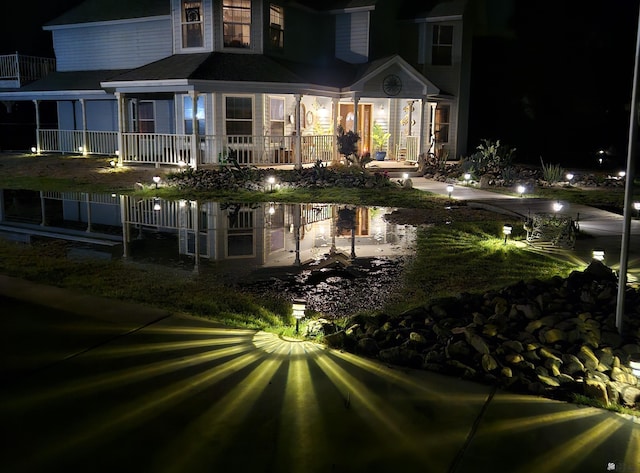 view of back house at night