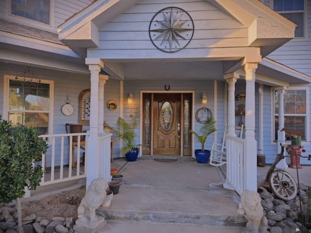 property entrance with covered porch