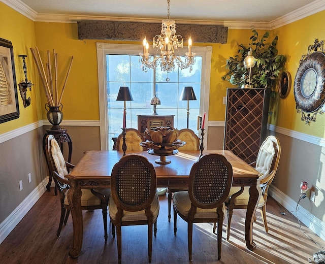 dining area with ornamental molding, a chandelier, and wood-type flooring