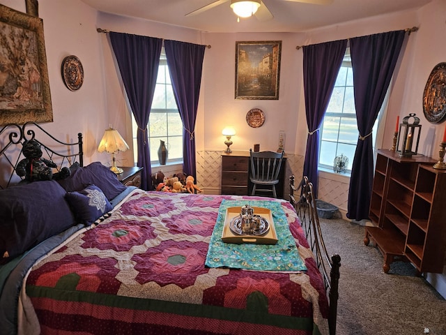 bedroom featuring carpet floors, multiple windows, and ceiling fan