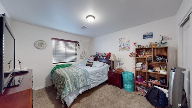 carpeted bedroom with a closet