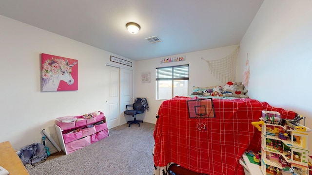 bedroom with carpet and a closet