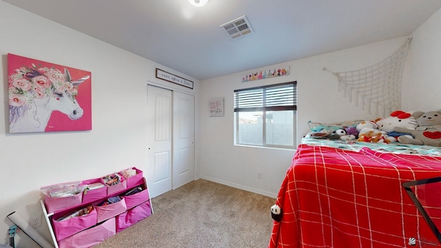 carpeted bedroom with a closet