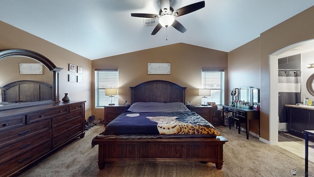 bedroom featuring ceiling fan, vaulted ceiling, and carpet