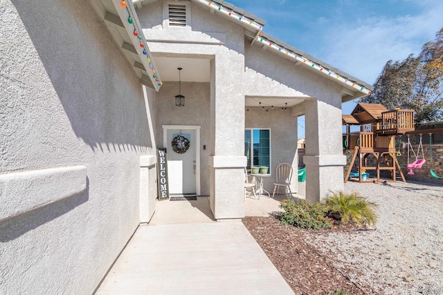 doorway to property with stucco siding