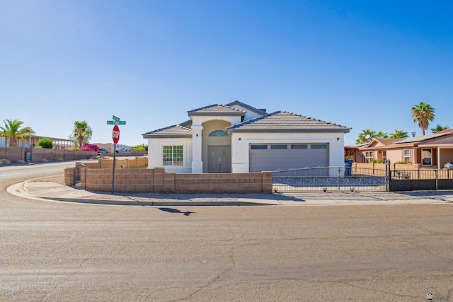 mediterranean / spanish house featuring a garage