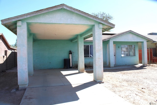 back of property with a patio