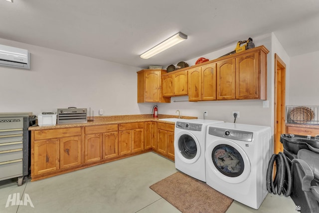 laundry room featuring sink, cabinets, an AC wall unit, and independent washer and dryer