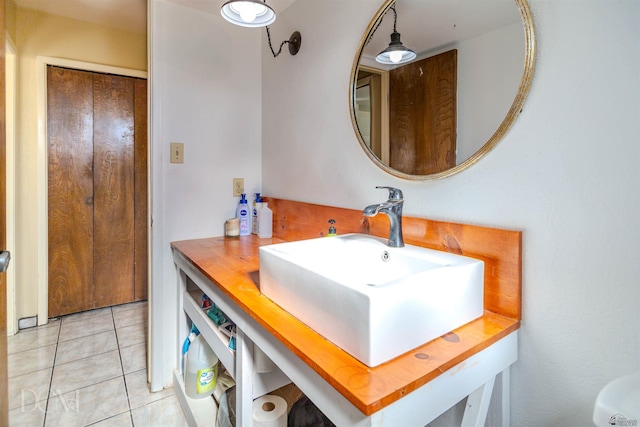 bathroom with tile patterned flooring and vanity