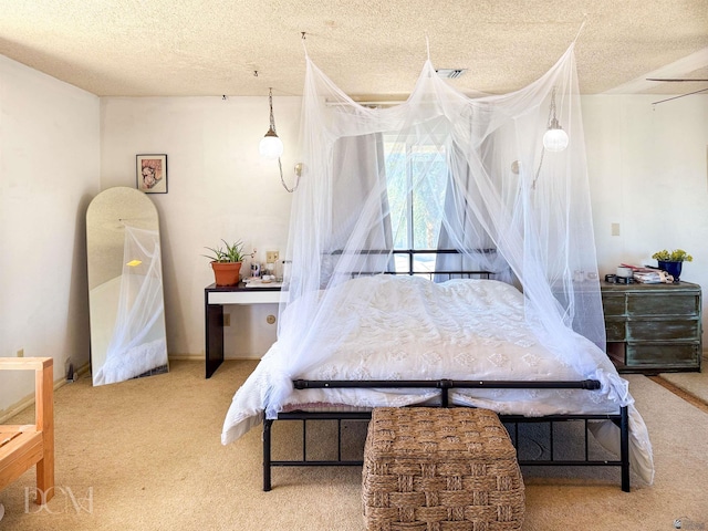 carpeted bedroom with a textured ceiling