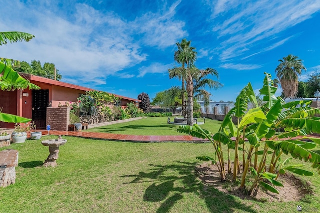 view of property's community featuring a yard