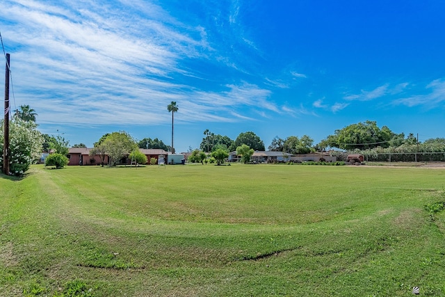 view of home's community with a yard