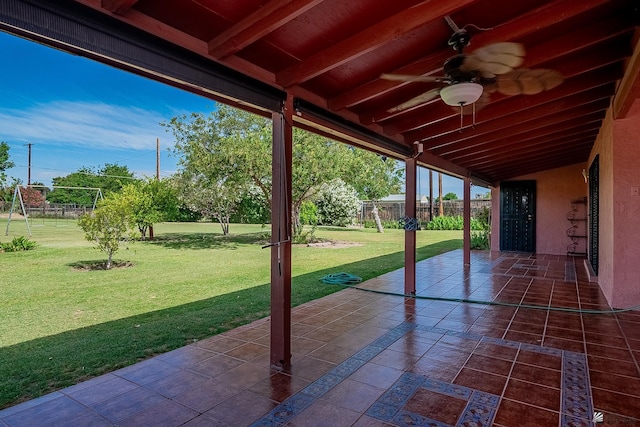 view of patio featuring fence and a ceiling fan